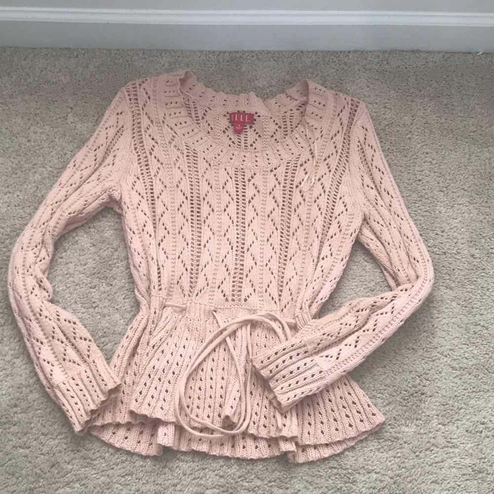 A see through sweater, blush pink